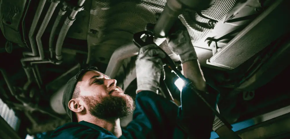 Man checking Exhaust System